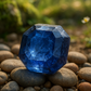 Image of an ocagonal saphire stone that looks natural with relatable natural background